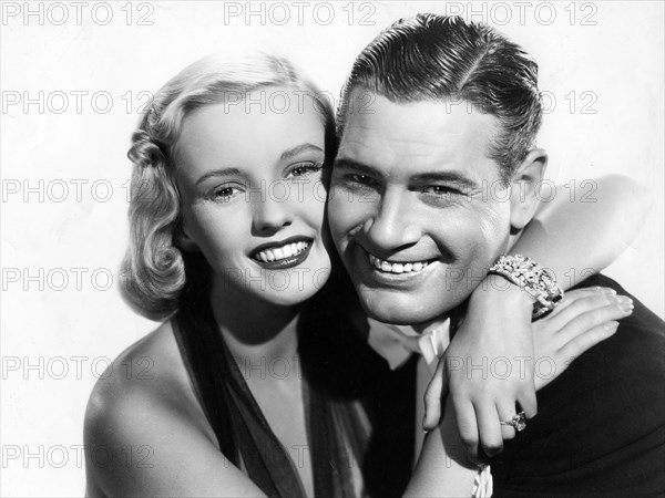 Phyllis Brooks, Richard Arlen, publicity portrait for the film, "Straight, Place And Show", 20th Century-Fox, 1938