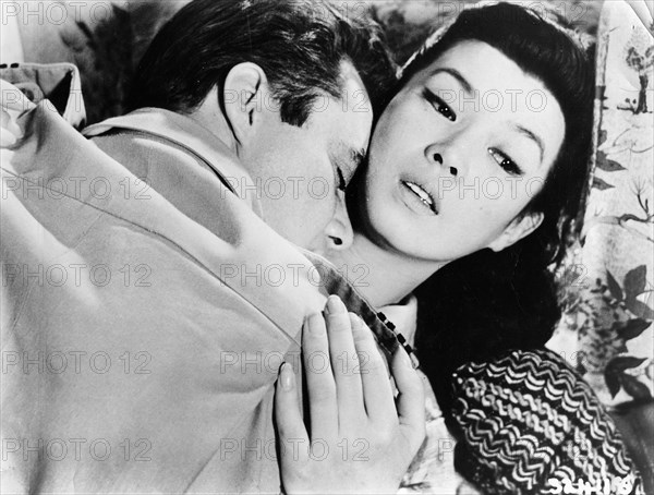 Dirk Bogarde, Yoko Tani, on-set of the film, "The Wind Cannot Read", Rank Film Distributors, 1958, 20th Century Fox, USA, 1960