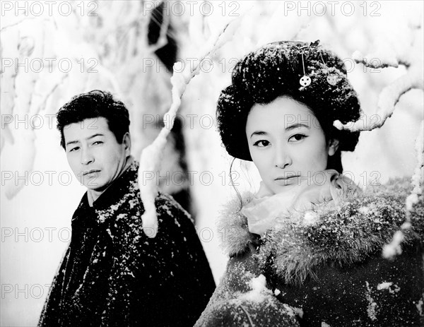 Keiko Kishi, Ryo Ikebe, on-set of the Japanese film, "Yukiguni", English title: "Snow Country", Toho Company, 1957