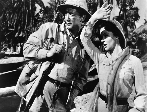 Robert Mitchum, Susan Hayward, on-set of the film, "White Witch Doctor", 20th Century-Fox, 1953