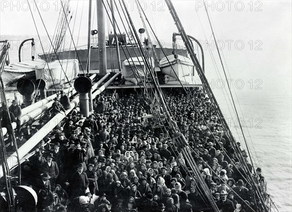 Crowd of men and women immigrants on deck of S.S. Patricia, Edwin Levick, December 1906