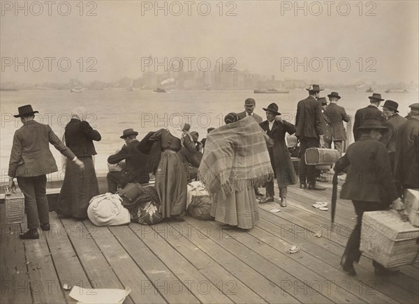 Immigrants waiting to be transferred, Ellis Island, New York City, New York, USA, Underwood & Underwood, October 30, 1912