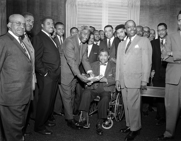 Former Brooklyn Dodgers baseball players Jackie Robinson and Roy Campanella (in wheelchair) with African American staff of the Department of State, Washington, D.C., USA, Robert H. McNeill, Robert H. McNeill, Robert H. McNeill Family Collection, 1962