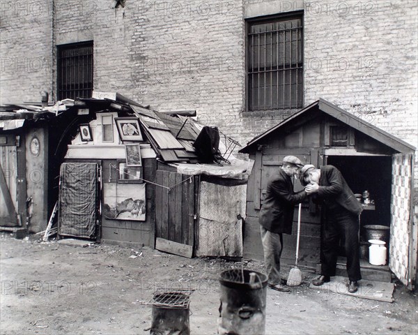 Two homeless men smoking cigarettes, unemployed and huts, West Houston and Mercer Streets, New York City, New York, USA, Berenice Abbott, Federal Art Project, "Changing New York", October 1935