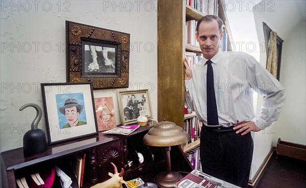 American Director and Producer John Waters, three-quarter length portrait at his home, Baltimore, Maryland, USA, Michael Geissinger, 1994