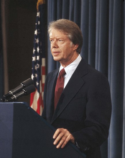 U.S. President Jimmy Carter at podium during news conference, half-length profile portrait, Washington D.C., USA, Bernard Gotfryd, between 1977 and 1981