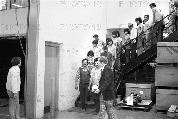 immigration & naturalization Service agents lead suspected undocumented immigrants during raid at factory, Chicago, Illinois, USA, Marion S. Trikosko, U.S. News & World Report Magazine Photograph Collection, June 21, 1977