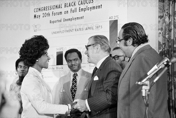 U.S. Vice President Nelson Rockefeller shaking hands with Shirley Chisholm, member of Congressional Black Caucus, as other members Charles Rangel and Walter Fauntroy look on during full employment forum, Washington, D.C., USA, Thomas J. O'Halloran, U.S. News & World Report Magazine Photograph Collection, May 20, 1975