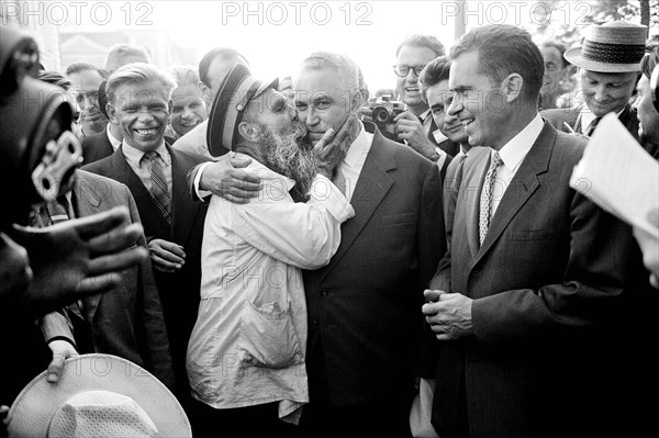 U.S. Vice President Richard Nixon watching as man kisses Soviet politician Frol Kozlov during Nixon's visit to the Soviet Union, Thomas J. O'Halloran, U.S. News & World Report Magazine Photograph Collection, July 1959