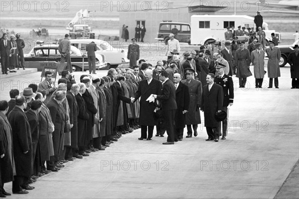 U.S. President Dwight Eisenhower shaking hands with line of men, Turkish president Celal Bayar standing behind him, Ankara, Turkey, Thomas J. O'Halloran, U.S. News & World Report Magazine Photograph Collection, December 9, 1959