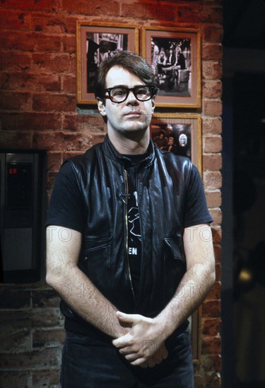 American actor Dan Aykroyd, half-length portrait, on-set of MTV Music Television, New York City, New York, USA, Bernard Gotfryd, 1982