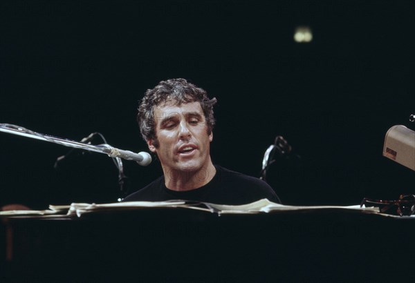 Burt Bacharach, American composer and pianist, half-length portrait during rehearsal, Long Island, New York, USA, Bernard Gotfryd, 1975