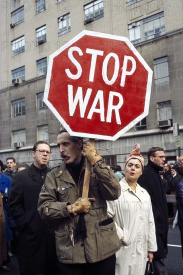 Man holding Stop War sign at anti-war rally, New York City, New York, USA, Bernard Gotfryd, 1969