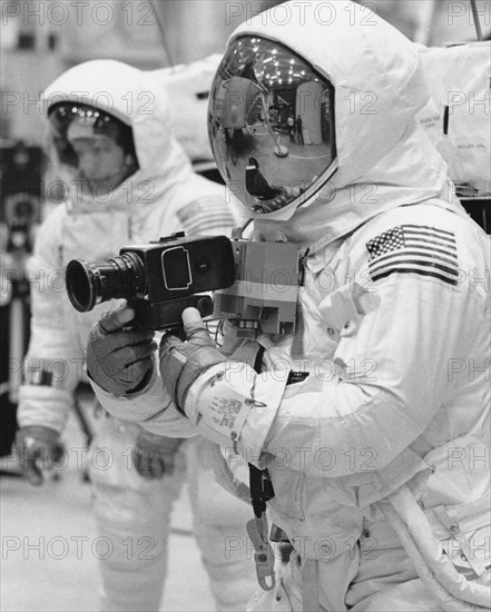 Apollo 11 Spacecraft Commander Neil Armstrong (front) and Lunar Module Pilot Edwin E. Aldrin (rear) practice lunar surface mobility in pressurized space suits, Manned Spacecraft Center, Houston, Texas, USA, NASA, April 1969