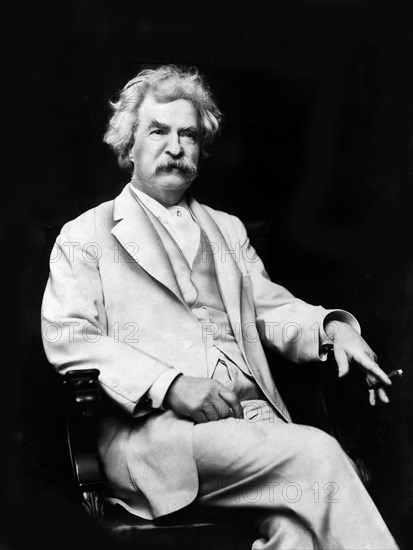 American Writer and Humorist Samuel Clemens, better known as Mark Twain, three-quarter length seated portrait wit cigar in hand, A.F. Bradley, 1907