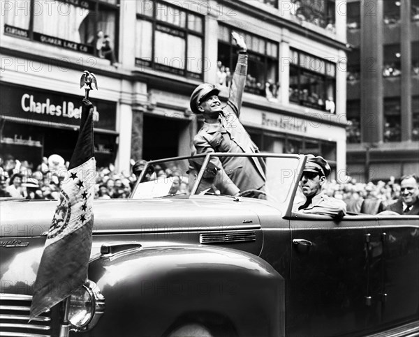 U.S. General Dwight D. Eisenhower waves from automobile during ticker tape parade, New York City, New York, USA, Fred Palumbo, New York World-Telegram and the Sun Newspaper Photograph Collection, June 19, 1945