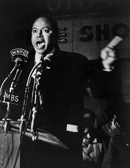 James Farmer, American civil rights activist, speaking before microphones outside Hotel Theresa, New York City, New York, USA, Stanley Wolfson, New York World-Telegram and the Sun Newspaper Photograph Collection, 1965