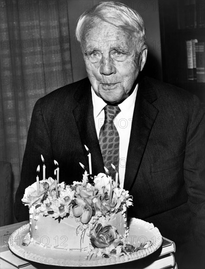 American poet Robert Frost, half-length portrait with his birthday cake on his 85th birthday, Walter Albertin, New York World-Telegram and the Sun Newspaper Photograph Collection, 1959