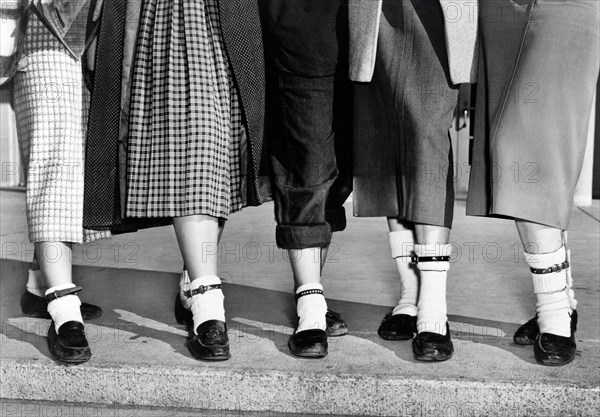 Legs and feet of five teenage girls wearing dog collar anklets on their socks, New York City, New York, USA, Roger Higgins, New York World-Telegram and the Sun Newspaper Photograph Collection, 1953