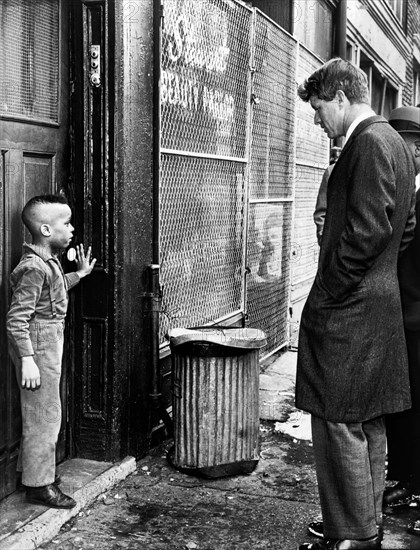 U.S. Senator Robert Kennedy discussing school with young Ricky Taggart of 733 Gates Avenue, Bedford-Stuyvesant, Brooklyn, New York City, New York, USA, Dick DeMarsico, New York World-Telegram and the Sun Newspaper Photograph Collection, February 4, 1966