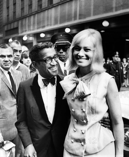 Sammy Davis, Jr., and his wife May Britt attending Broadway premiere of "The Roar of the Greasepaint - The Smell of the Crowd", Shubert Theater, New York City, New York, USA, Stanley Wolfson, New York World-Telegram and the Sun Newspaper Photograph Collection, May 1965