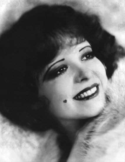 Clara Bow, American actress, head and shoulders publicity portrait with heart-shaped beauty mark on her face, Underwood & Underwood, 1926