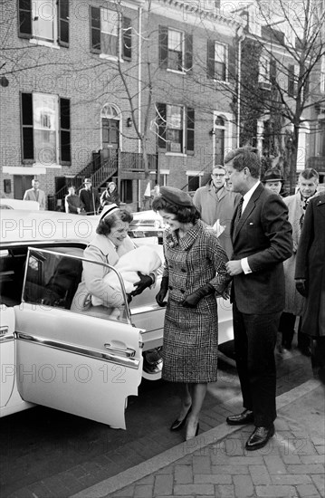 U.S. President-Elect John Kennedy with wife Jacqueline Kennedy as they return to their Georgetown home with their newborn son John Kennedy, Jr., nurse Luella Hennessey holding the baby, Washington, D.C., USA, Marion K. Trikosko, U.S. News & World Report Magazine Photograph Collection, December 22, 1960