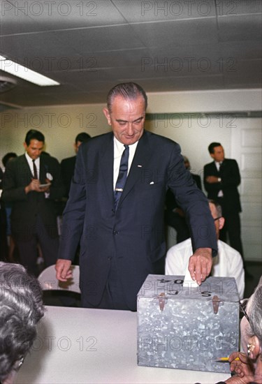 U.S. President Lyndon B. Johnson placing his vote in ballot box, Pedernales Electric Co-op Building, Johnson City, Texas, USA, Cecil Stoughton, November 3, 1964