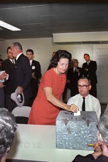 U.S. First Lady Claudia "Lady Bird" Johnson placing her vote in ballot box, Pedernales Electric Co-op Building, Johnson City, Texas, USA, Cecil Stoughton, November 3, 1964