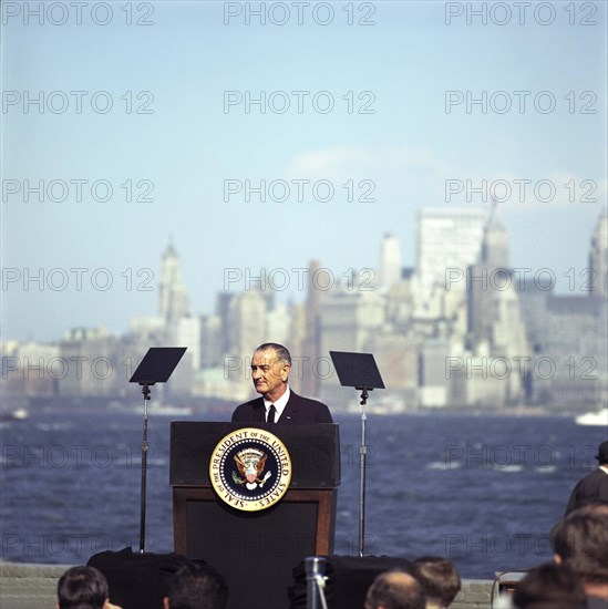 U.S. President Lyndon B. Johnson speaking at podium before signing the Immigration and Nationality Act of 1965, Liberty Island, New York City, New York, USA, Frank Wolfe, October 3, 1965