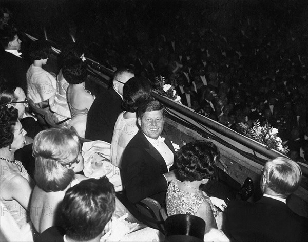 U.S. President John Kennedy and First Lady Jacqueline Kennedy watching Inaugural Ball proceedings, National Guard Armory, Washington, D.C., USA, Abbie Rowe, White House Photographs, January 20, 1961