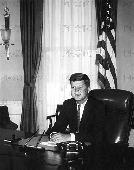 U.S. President John Kennedy at his desk (first White House photograph made of the President at his desk), Oval Office, White House, Washington, D.C., USA, Abbie Rowe, White House Photographs, January 21, 1961