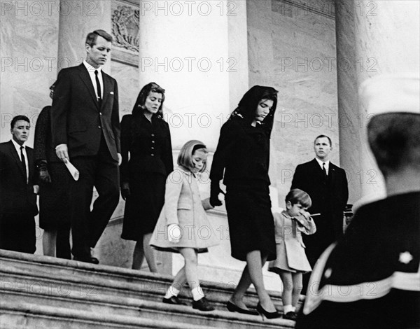 Former U.S. First Lady Jacqueline Kennedy and her children, Caroline Kennedy and John F. Kennedy, Jr., exiting U.S. Capitol Building where late U.S. President John Kennedy lies in state, walking behind: Peter Lawford, U.S. Attorney General, Robert F. Kennedy, Patricia Kennedy Lawford, Washington, D.C., USA, Abbie Rowe, White House Photographs, November 24, 1963