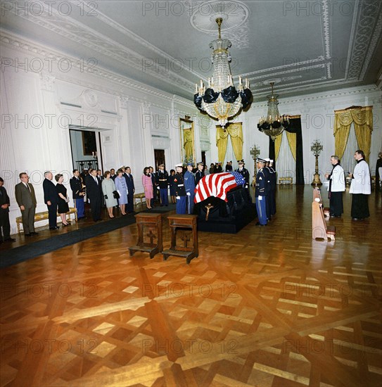 Late U.S. President John Kennedy’s flag-draped casket, First Lady Jacqueline Kennedy, Attorney General, Robert Kennedy, Jean Kennedy Smith, Ethel Skakel Kennedy, R. Sargent Shriver, Janet Auchincloss, Hugh D. Auchincloss; Secretary of Defense, Robert S. McNamara, among other mourners, East Room, White House, Washington, D.C., USA, Robert Knudsen, White House Photographs, November 23, 1963