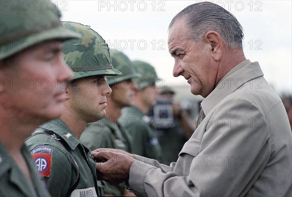 U.S. President Lyndon B. Johnson awarding Distinguished Service Cross to First Lieutenant Marty A. Hammer during visit to Cam Ranh Bay, South Vietnam, Yoichi Okamoto, October 26, 1966