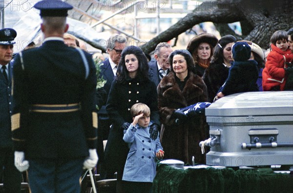 Lyn Nugent saluting as Luci Johnson Nugent, Lady Bird Johnson, and Lynda Johnson Robb listen during burial services for former U.S. President Lyndon Johnson, Stonewall, Texas, USA, Frank Wolfe, January 15, 1973