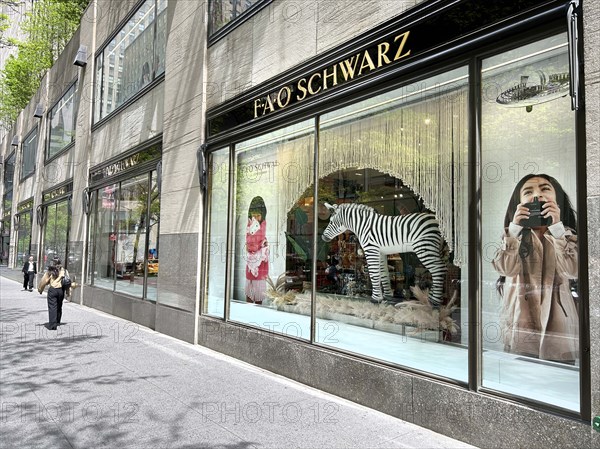 FAO Schwarz store, building exterior and sidewalk scene, Rockefeller Center, New York City, New York, USA