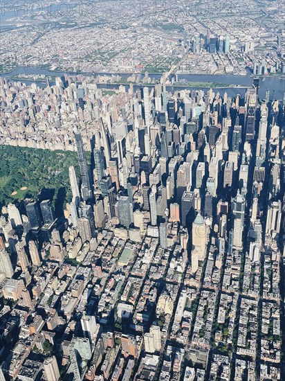 Aerial view of midtown Manhattan, Central Park and Upper East Side in foreground and Roosevelt Island, East River and Queens County in background, New York City, New York, USA