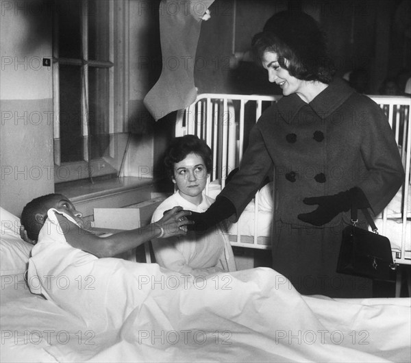 U.S. First Lady Jacqueline Kennedy visiting with patients at Children’s Hospital, Washington D.C., USA, Abbie Rowe, White House Photographs, December 12, 1961