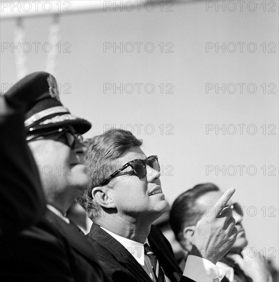 U.S. President John Kennedy sitting between General George H. Decker, Chief of Staff of U.S. Army and Elvis Jacob Stahr, Jr., Secretary of the Army, while visiting 82nd Airborne Division, Pope Air Force Base, Fort Bragg, North Carolina, USA, Cecil Stoughton, White House Photographs, October 12, 1961