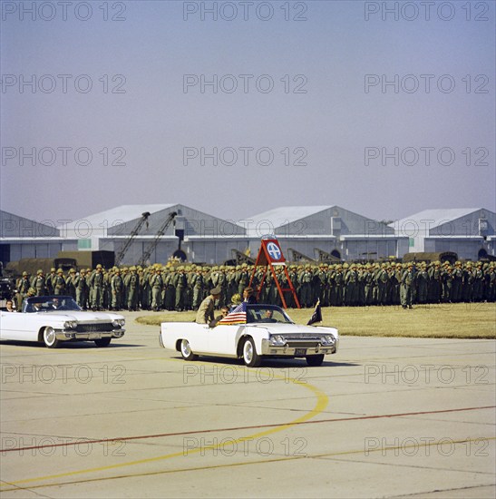 U.S. President John Kennedy riding in open convertible car past soldiers in review formation while visiting 82nd Airborne Division, Pope Air Force Base, Fort Bragg, North Carolina, USA, Cecil Stoughton, White House Photographs, October 12, 1961