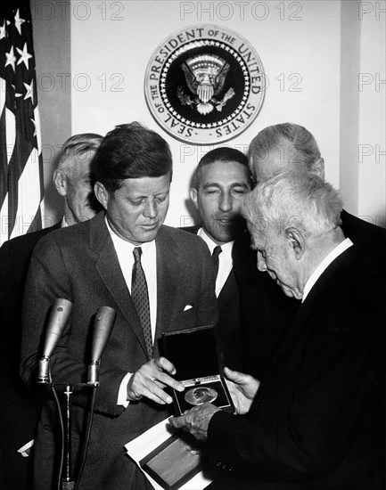 U.S. President John F. Kennedy presenting Congressional Gold Medal to American poet Robert Frost, White House, Washington, D.C., USA, Abbie Rowe, White House Photographs, March 26, 1962