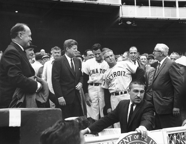 U.S. President John F. Kennedy talking with James “Mickey” Vernon, manger of the Washington Senators, Bob Scheffing, Manager of the Detroit Tigers and Ed Doherty, General Manager of the Washington Senators (far right), during first game of baseball season, D.C. Stadium, Washington, D.C., USA, Abbie Rowe, White House Photographs, April 9, 1962