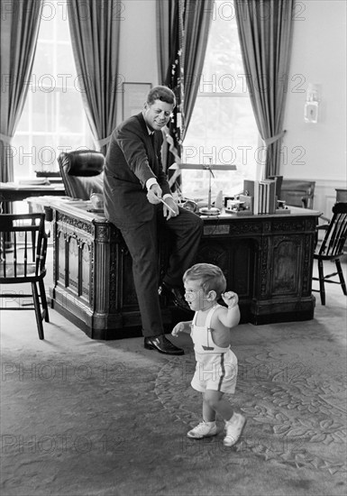 U.S. President John F. Kennedy and his son John F. Kennedy, Jr., in Oval Office, White House, Washington, D.C., USA, Robert Knudsen, White House Photographs< May 25, 1962