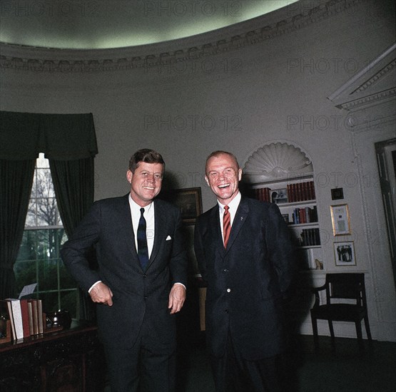 U.S. President John F. Kennedy standing with astronaut John H. Glenn, Jr., Oval Office, White House, Washington, D.C., USA, Robert Knudsen, White House Photographs, February 5, 1962