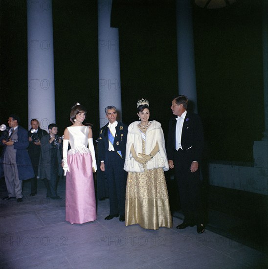 U.S. First Lady Jacqueline Kennedy, Mohammad Reza Pahlavi, Shah of Iran with his wife Empress Farah Pahlavi and U.S. President, John F. Kennedy, group portrait upon the Shah's arrival at White House for dinner in their honor, Washington, D.C., USA, Robert Knudsen, White House Photographs, April 11, 1962