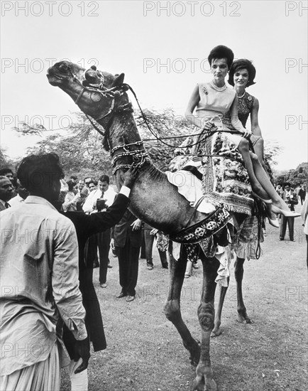 U.S. First Lady Jacqueline Kennedy with her sister, Princess Lee Radziwill of Poland, riding on elephant through grounds of President Mohammad Ayub Khan's residence, Karachi, Sindh, Pakistan, Cecil Stoughton, White House Photographs, March 25, 1962