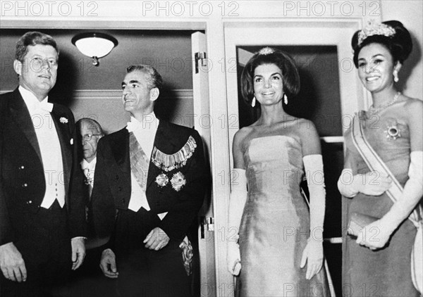 U.S. President John Kennedy, Mohammad Reza Pahlavi, Shah of Iran, U.S. First Lady Jacqueline Kennedy, and Empress Farah Pahlavi, attending dinner, Embassy of Iran, Washington, D.C., USA, Cecil Stoughton, White House Photographs, April 12, 1962