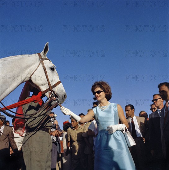 U.S. First Lady Jacqueline Kennedy feeding horse while attending polo match, Jaipur, Rajasthan, India, Cecil Stoughton, White House Photographs, March 19, 1962