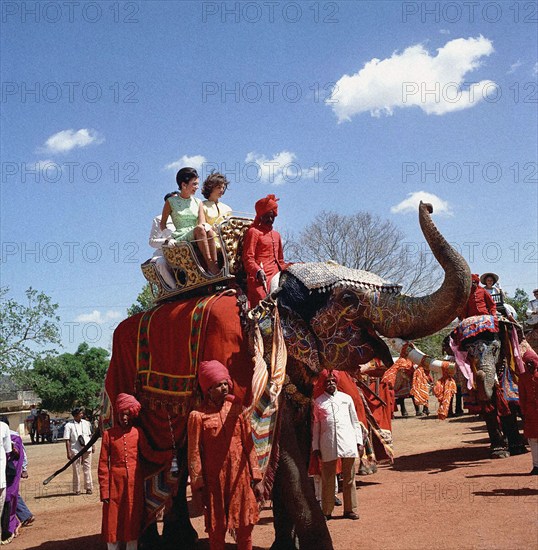 U.S. First Lady Jacqueline Kennedy with her sister, Princess Lee Radziwill of Poland, riding on elephant in courtyard of Amber Palace, Jaipur, Rajasthan, India, Cecil Stoughton, White House Photographs, March 19, 1962